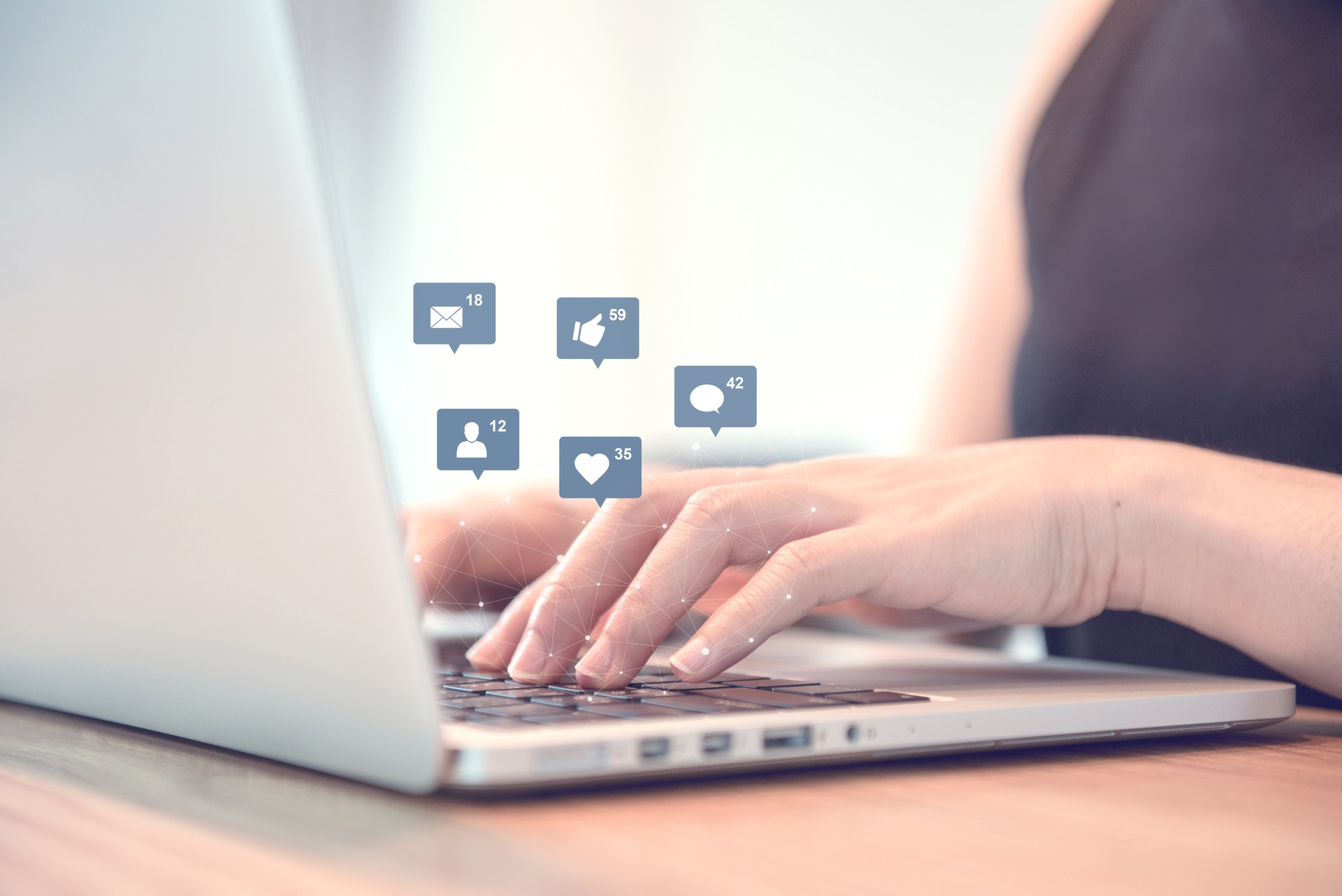 Businesswoman hands using laptop with icon social media and social network.